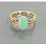 14ct ladies ring set with jade stone: Size M, 3 grams.