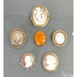 A collection of antique brooches: Including large cameos etc.