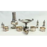 Group of hallmarked silver items: Includes small footed dish, napkin rings, sugar caster,