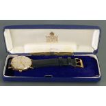 Garrard 9ct gold quartz gents wristwatch: With leather strap and original box.