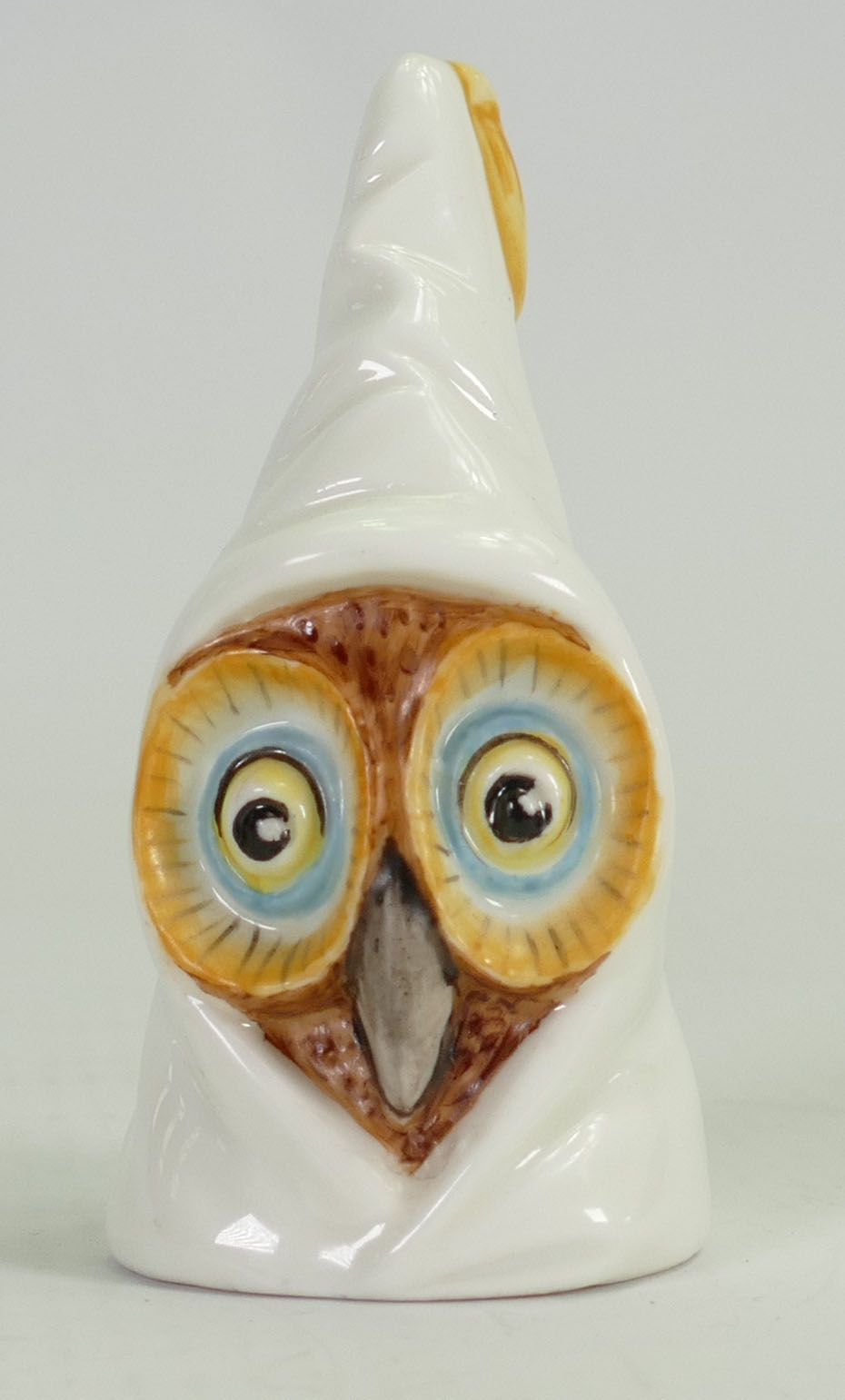 Royal Worcester candle snuffer as a hooded owl: Height 8cm.