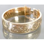 9ct gold ladies ornate bangle: 21.6 grams.