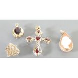 A good collection of 9ct gold gem set pendants: Comprising teardrop cameo,