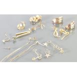 A collection of 9ct gold earrings: Some damage, 11.2 grams.