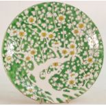 Chinese porcelain plate decorated with white flowers on green ground: Diameter 21cm.