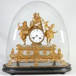 19th century French gilt metal clock: Decorated with a lady dancer & musician in oval glass dome,