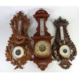 A collection of vintage Barometers: Including carved Black Forest, gilt, wooden examples etc.