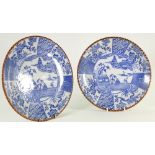 Early 20th century Japanese porcelain pair of blue willow plaques: Diameter 24cm.