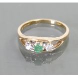 9ct ladies ring: Set with diamonds and emerald stone, size P, 3.1 grams.