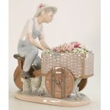 Lladro large figure group of a boy with a cart of flowers: Flower Peddler F-23J, height 26cm.