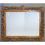 Early 20th century carved Oak Wall Mirror: 99cm x 70cm