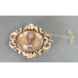 Mid 19th century yellow coloured ornate metal brooch with hair: The back of which tests for 15ct