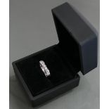 Platinum set 9 stone diamond eternity ring: Weight 7.6g, diamonds each measuring about 3mm.