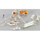 A good collection of 9ct gold gem set earrings: Gross weight 12.2 grams.