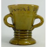 Ewenny Pottery Loving Cup: In green glaze with three loop handles and a ribbed waist,