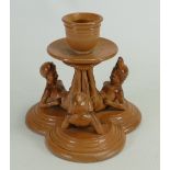 Rare Doulton Lambeth Tinworth candlestick: A Stoneware candlestick modelled as three seated