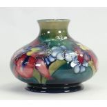Walter Moorcroft squat vase decorated in the Orchid design: H 11cm x d13cm, c1950s.