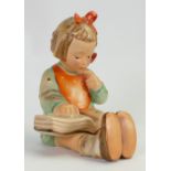 Goebel Hummel early figure of a seated girl reading a book: Height 16cm.