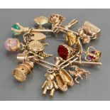 9ct gold Charm bracelet set with 16 charms: Some set with coloured stones, overall weight 82.