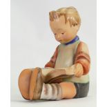 Goebel Hummel early figure of a seated boy reading a book: Height 15cm.