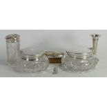 A collection of silver items: Including various silver topped scent bottles, thimble,