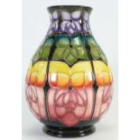 Moorcroft large Violet vase by Sally Tuffin: Decorated in unusual bright colours,