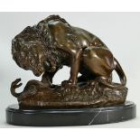 Reproduction Bronze figure of a Lion & Snake: Mounted on black marble base, height 22cm.
