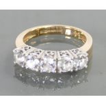 14ct ring set with 5 CZ stones: Size M/N, 5 grams.