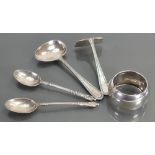 A collection of silver items: Including various spoons and serviette ring, 80 grams.