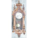 19th century Walnut Spring Driven Wall Clock: With Gothic style case "Peerless Doppal Gong" mounted