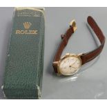 Rolex 9ct gold gentlemans 1950s wristwatch: With original leather strap and 9ct gold Rolex buckle,