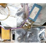 A box of mixed wrist watch straps and electric clock movements, clock winders etc.