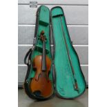 20th century Violin: Hard cased, in need of repair,