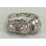 18ct white gold diamond ring: The three larger diamonds surrounded by diamond chips,