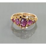 Antique 15ct ring set with 5 amethysts & seed pearls: 2 grams.
