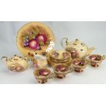 A collection of Aynsley Orchard Gold tea ware to include: Teapot, cups and saucers etc.