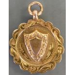 Victorian 9ct gold shield medal: 4.6 grams.