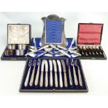 A collection of silver items: Including photo frame, 4 boxed serviette rings 126grams,