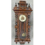 19th century Walnut Vienna spring driven Wall clock: Key hole carved case, height 148cm with eagle,