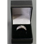 18ct white gold diamond Cluster ring: The centre double bands set with baguette diamonds surrounded
