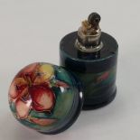 Walter Moorcroft unusual table lighter: Decorated in the Freesia design, height 7cm.