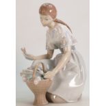 Lladro large figure of a girl with tulips: Height 25cm. (Small crack to basket handle).