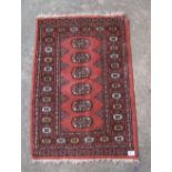 Small Turkish Hand Tied bokhara patterned rug: width 60cm x length 92cm