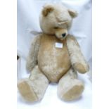 A Large Jointed Teddy Bear with growling noise: height seated 43cm