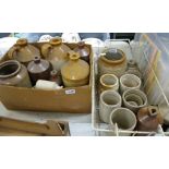 A large collection of stoneware jars and flagons: 2 trays.