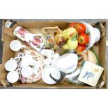 A mixed collection of items to include coffee cans: plates, ceramic basket with fruit, salt and
