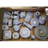 A collection of Wedgwood jasperware: to include plates, bud vases, lidded boxes, candlestick, bell