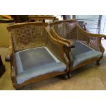 A pair of French oak and bergere cane work 1930's armchairs: