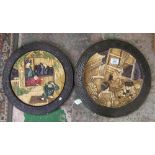 A pair of Bretby pottery circular wall plaques: relief moulded with traditional Japanese figural