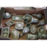 A collection of Wedgwood green jasperware: to include a pair of small flared vases, lidded boxes,